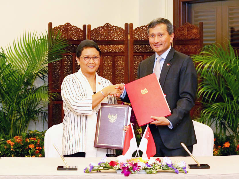 Indonesian Minister for Foreign Affairs Retno Marsudi and Minister for Foreign Affairs Dr Vivian Balakrishnan participate in a signing ceremony and exchange the Instruments of Ratification for the Treaty between Indonesia and Singapore relating to the Delimitation of the Territorial Seas of the Two Countries in the Eastern Part of the Strait of Singapore. Photo: Nuria Ling/TODAY