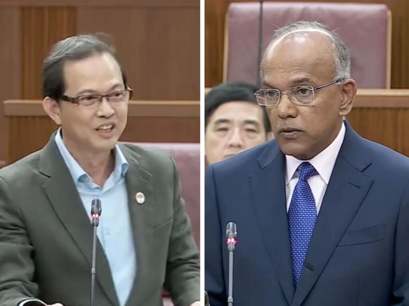 Mr Leong Mun Wai (left), a Non-Constituency Member of Parliament, and Law Minister K Shanmugam (right) debating in Parliament about disclosing the names of people under police investigation.