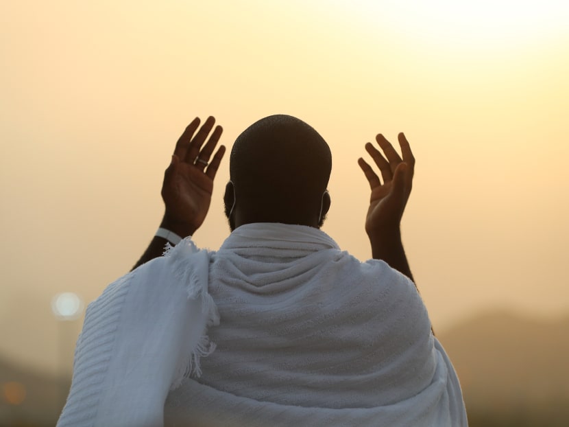 A handout picture provided by Saudi Ministry of Media on July 30, 2020 shows a Muslim pilgrim praying on Mount Arafat, also known as Jabal al-Rahma (Mount of Mercy), southeast of the holy city of Mecca, during the climax of the Haj pilgrimage amid the Covid-19 pandemic.