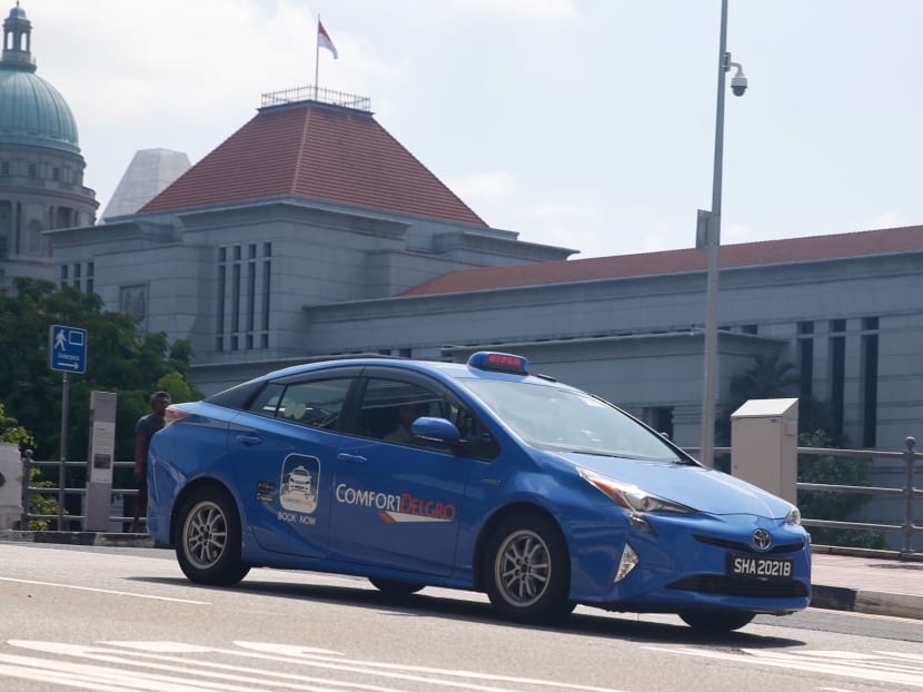 Grab will be issued a warning letter from the authorities for opening its flat-fare JustGrab service to ComfortDelGro cabbies, a move that has been seen as an attempt to undercut a tie-up between the dominant taxi operator and rival ride-hailing company Uber. Photo: Najeer Yusof/TODAY