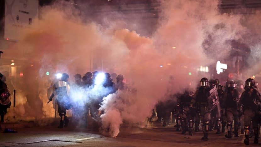 Police fire tear gas as protests swell after Hong Kong mask ban Police fire tear gas as protests swell after Hong Kong mask ban