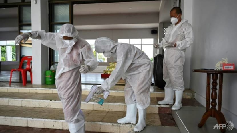 Thai monks don protective gear as COVID-19 cases surge Thai monks don protective gear as COVID-19 cases surge