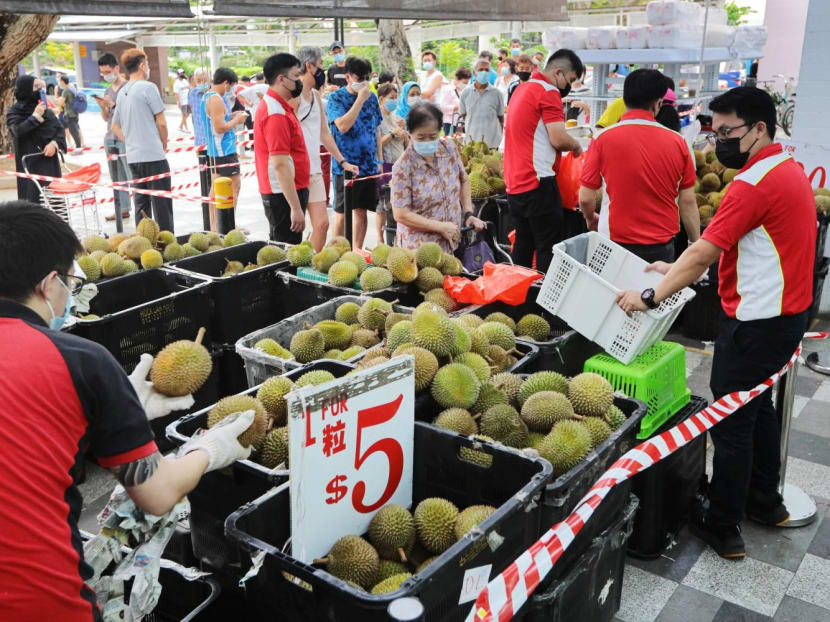 People in Singapore queueing to buy durians in June 2021.
