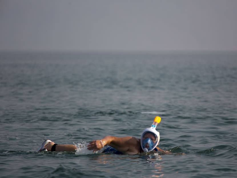 British long-distance swimmer, Jackie Cobell, swims in the salty waters of the Dead Sea, from Jordan to Israel. Photo: AP