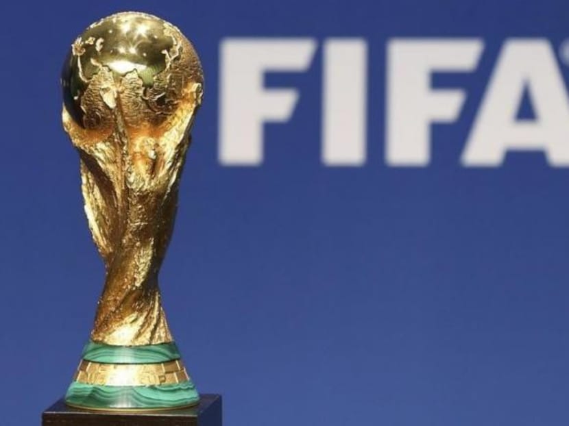 A replica of the FIFA Soccer World Cup Trophy is pictured at the FIFA headquarters in Zurich January 23, 2014. Photo: Reuters