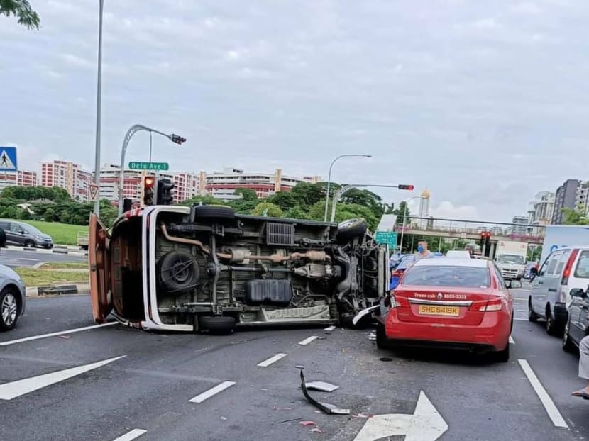In videos circulating on social media, taken on a dashcam camera, a white minibus can be seen veering into the right lane of Tampines Road before hitting a taxi. The impact caused damage to the front passenger side of the taxi as the minibus tipped onto its side.