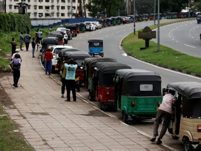 Three-wheeler drivers wait in a queue to buy petrol due to fuel shortage, amid the country's economic crisis, in Colombo, Sri Lanka June 17, 2022. Three-wheeler drivers wait in a queue to buy petrol due to fuel shortage, amid the country's economic crisis, in Colombo, Sri Lanka June 17, 2022.