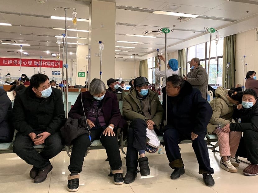 Patients with Covid-19 rest in a hallway at Fengyang People's Hospital in Fengyang County in east China's Anhui Province on Jan 5, 2023.