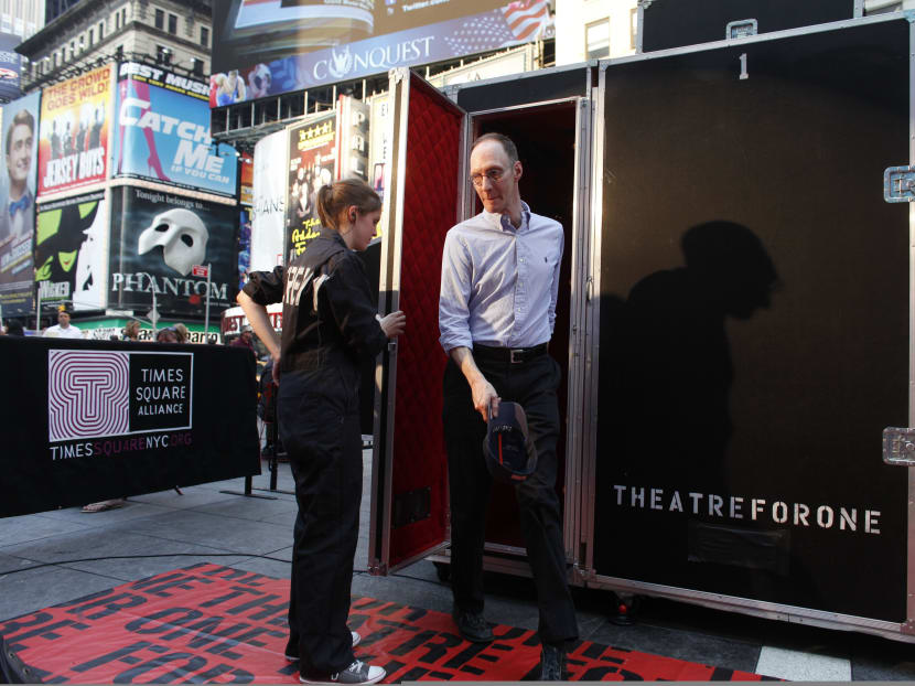 An audience member steps out of the Theatre for One performance space in New York's Times Square. Photo: AP