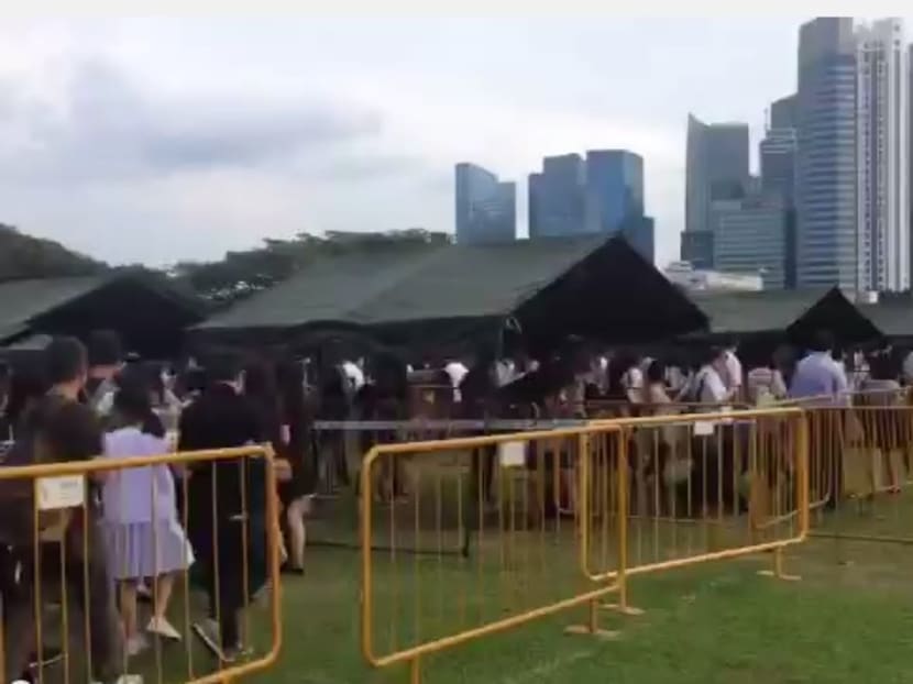 Continuous stream of people queuing at the Padang