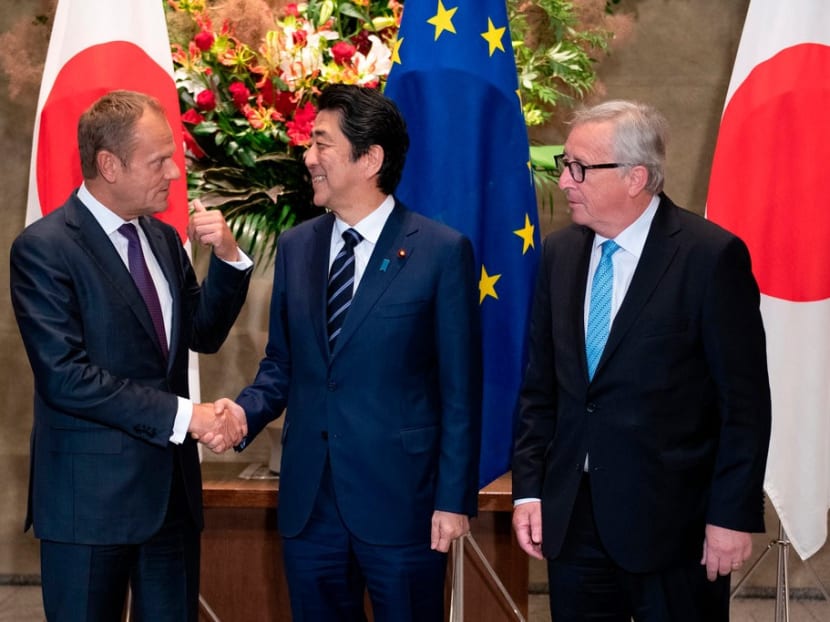 Prime Minister Shinzo Abe of Japan met with Mr Donald Tusk, the president of the European Council, left, and Mr Jean-Claude Junker, his counterpart at the European Commission, before signing a far-reaching trade deal in Tokyo.