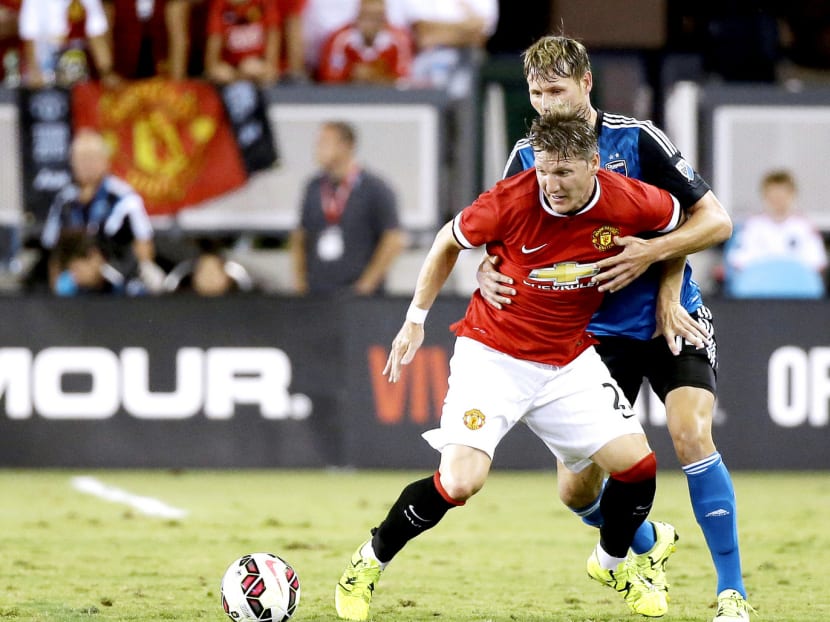 Bastian Schweinsteiger (in red) displayed experience and leadership in games against Club America and San Jose Earthquakes. Photo: AP