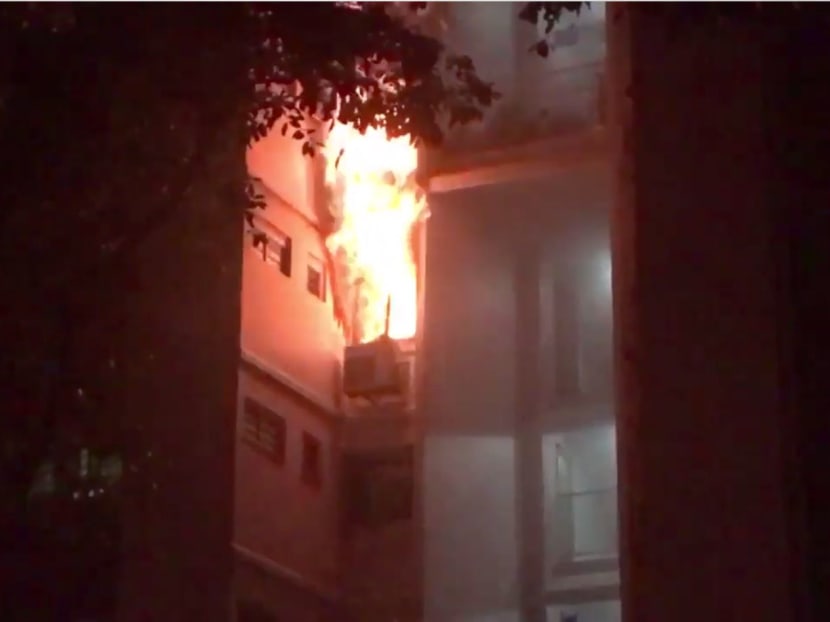 Screenshot taken from video showing a fire that broke out on the 5th floor of a bedroom at 818 Woodlands Street 82. Photo: @fire_snyper/Twitter