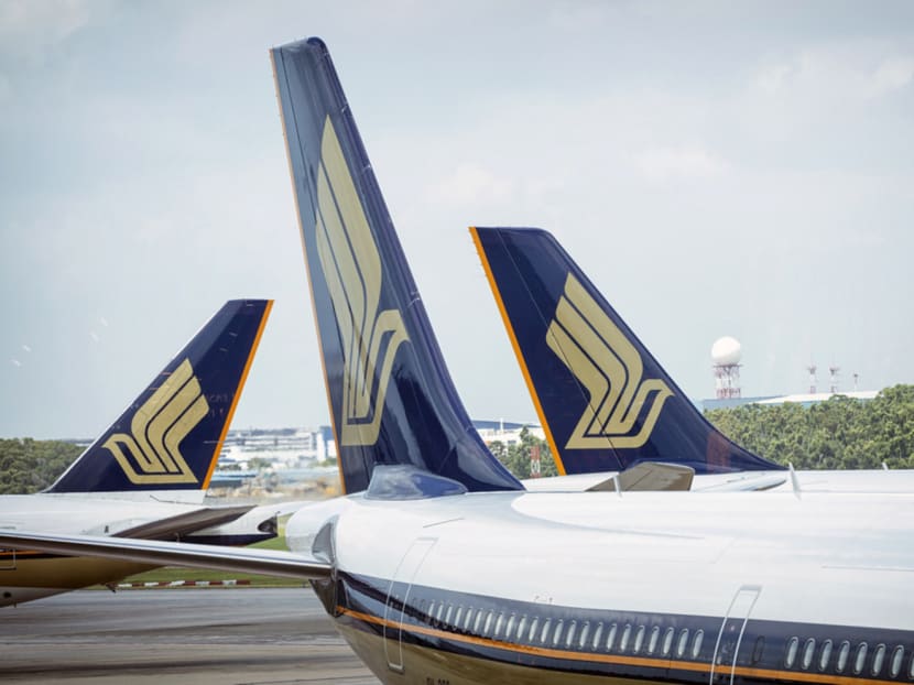 Singapore Airlines Ltd. aircraft sit at Changi Airport in Singapore, on Thursday, March 3, 2016. Photo: Bloomberg