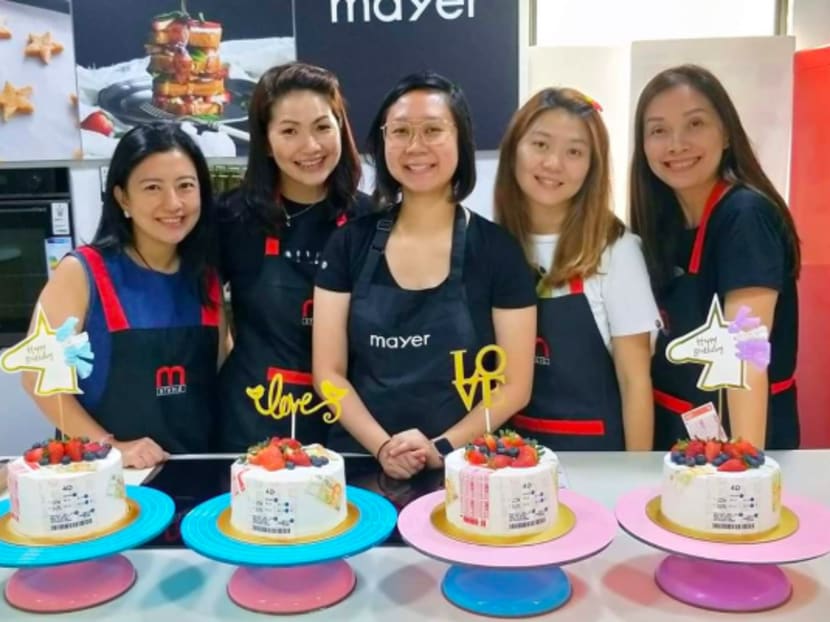 Ms Siti Hartini Hamdi (third from left) with students at a cake-making workshop she held before the circuit breaker started in early April 2020. She has trouble finding baking ingredients now.
