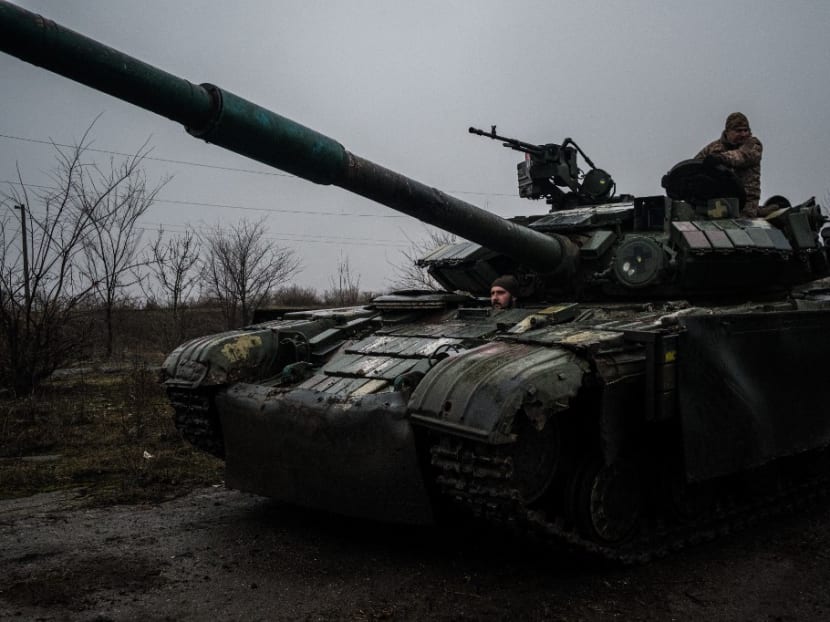 Ukrainian servicemen drive a T-64 tank along a road from the town of Chasiv Yar, Donetsk region to Bakhmut on March 9, 2023. Ukrainian servicemen drive a T-64 tank along a road from the town of Chasiv Yar, Donetsk region to Bakhmut on March 9, 2023.