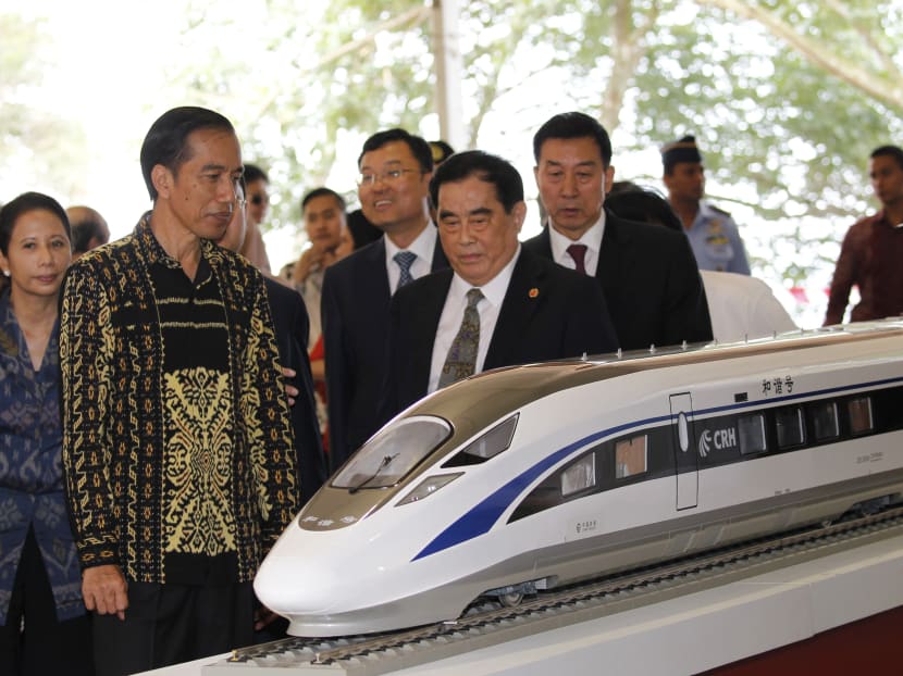 Indonesian President Joko Widodo and the general manager of China Railway Corp. Sheng Guangzu (centre) stand next to a model of a train while attending a ground breaking ceremony for the Jakarta-Bandung fast-train railway line in Walini, West Java province, in Jan 2016. The Jokowi administration is clearly facing both financial and time pressure to get the Jakarta-Bandung project running, says the author. Photo: Reuters