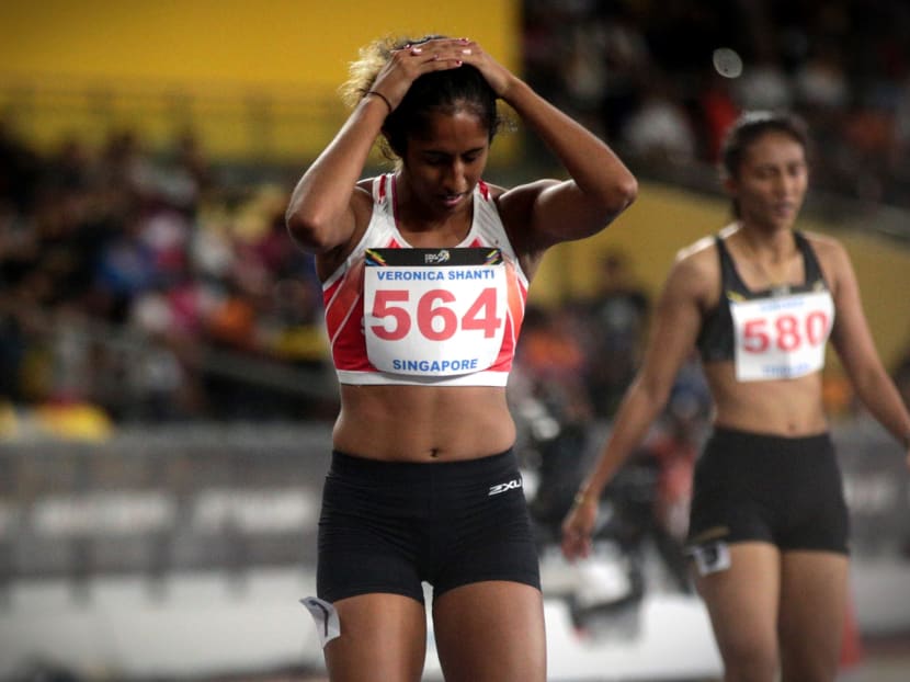 Shanti Pereira looking disappointed after her 200m final on Wednesday (Aug 22). Photo: Jason Quah/TODAY