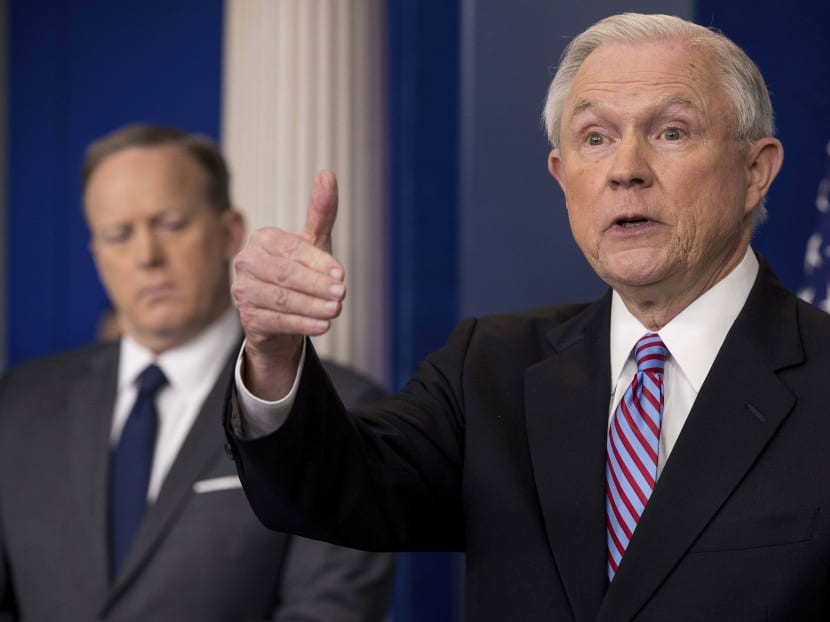 Attorney General Jeff Sessions (right), accompanied by White House press secretary Sean Spicer, at the daily press briefing at the White House on March 27. Photo: AP