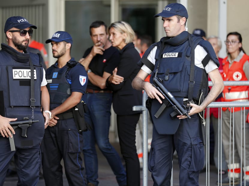 French Police stand in front of a Chapel of Rest to welcome families of victims three days after a truck mowed through revellers in Nice, France. Photo: AP