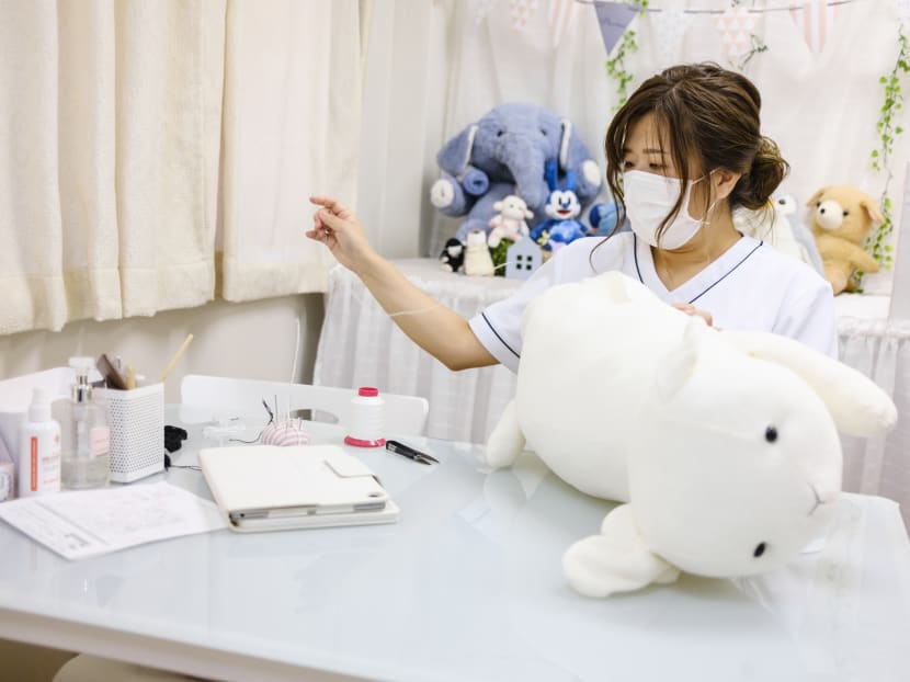 Natsumi Clinic Founder Natsumi Hakozaki working on client Yui Kato's stuffed toy sheep in Toyko. The clinic specialises in restoring much-loved teddies and other cuddly toys to their original glory, delighting deeply attached owners like Yui Kato. Natsumi Clinic Founder Natsumi Hakozaki working on client Yui Kato's stuffed toy sheep in Toyko. The clinic specialises in restoring much-loved teddies and other cuddly toys to their original glory, delighting deeply attached owners like Yui Kato.