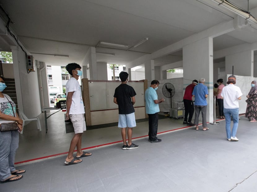 Residents of Block 506 Hougang Avenue 8 queueing to get tested for Covid-19 on May 21, 2021 at the void deck of the block. Residents of Block 506 Hougang Avenue 8 queueing to get tested for Covid-19 on May 21, 2021 at the void deck of the block.