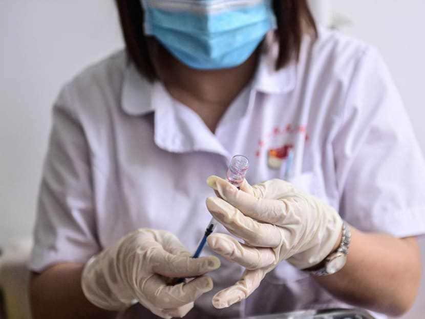 A medical staff member in China preparing a dose of the Sinovac Covid-19 vaccine.