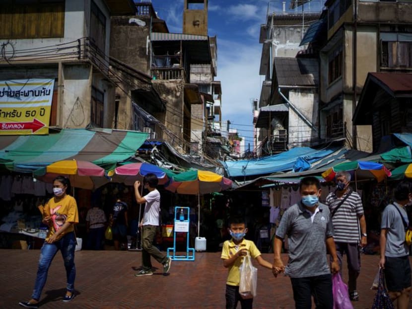 FILE PHOTO: People wearing face masks shop inside the Sampheng wholesale market as Thai government eases isolation measures, following the coronavirus disease (COVID-19) outbreak, in Bangkok, Thailand, June 10, 2020. REUTERS/Athit Perawongmetha FILE PHOTO: People wearing face masks shop inside the Sampheng wholesale market as Thai government eases isolation measures, following the coronavirus disease (COVID-19) outbreak, in Bangkok, Thailand, June 10, 2020. REUTERS/Athit Perawongmetha