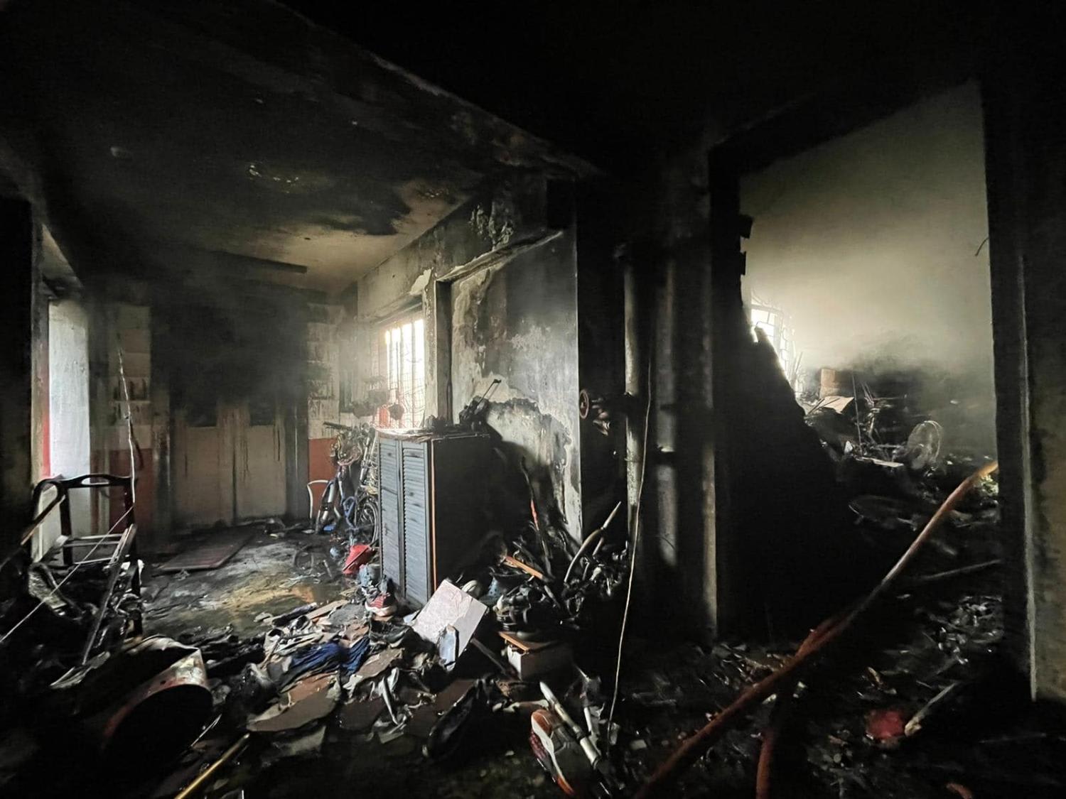 Damage caused by the fire along the corridor of the affected unit at Jurong East Street 21. Damage caused by the fire along the corridor of the affected unit at Jurong East Street 21.