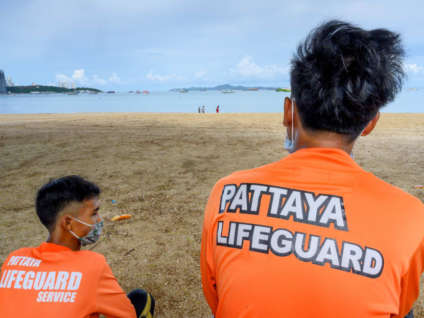 Lifeguards stand watch on the beach in Pattaya on June 1, 2020. People flocked back to some of Thailand's famed sandy beaches June 1, keeping well apart but enjoying the outdoors, as authorities lifted coronavirus restrictions for the first time in more than two months.