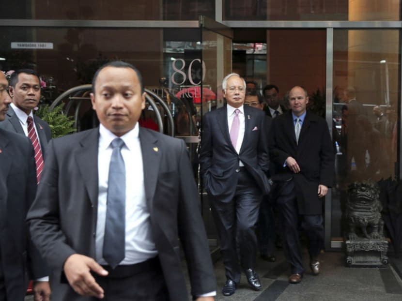 Mr Najib (centre) is holding fast, despite calls for him to step down. Photo: The New York Times