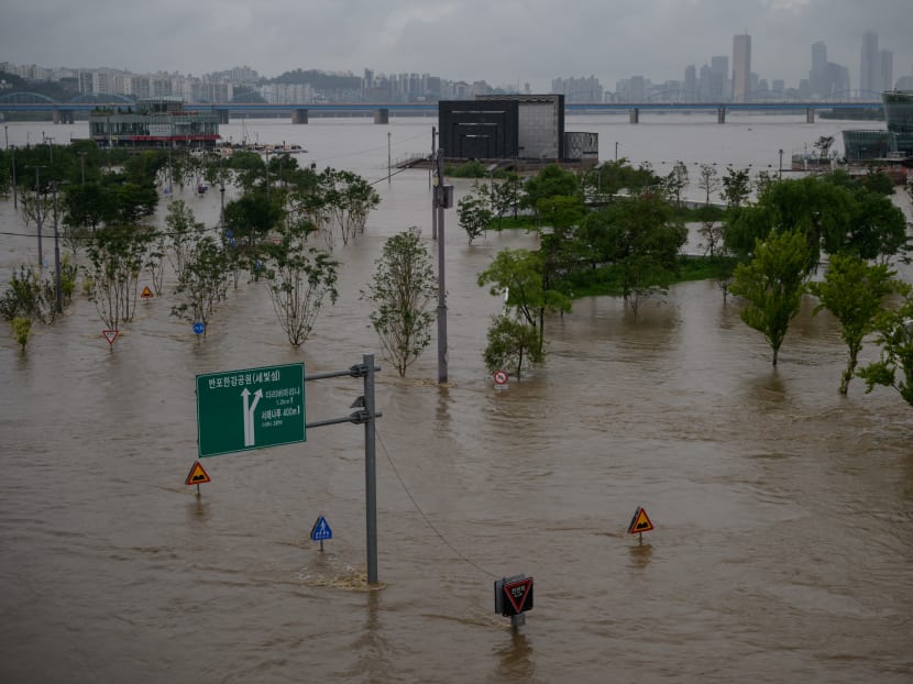 A general view shows flooding over a submerged park beside the Han river Seoul on Aug 3, 2020.