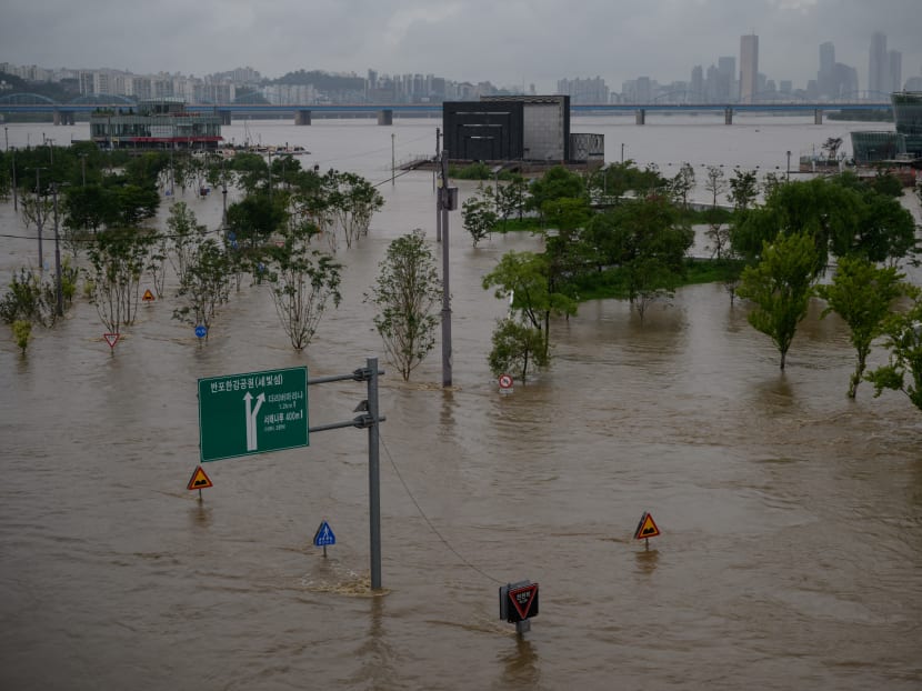 A general view shows flooding over a submerged park beside the Han river Seoul on Aug 3, 2020. A general view shows flooding over a submerged park beside the Han river Seoul on Aug 3, 2020.