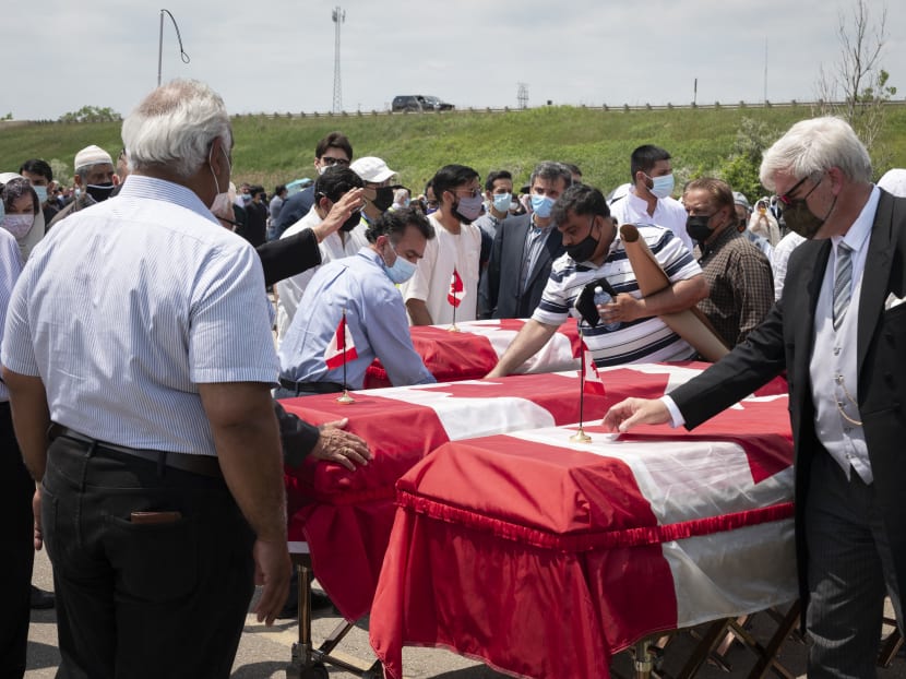Mourners and supporters gather for a public funeral for members of the Afzaal family at the Islamic Centre of Southwest Ontario in London, Canada on June 12, 2021.