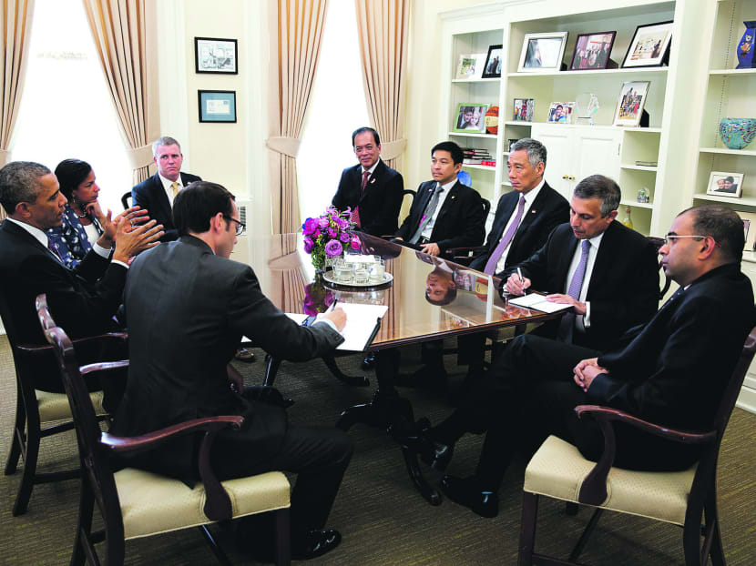 Mr Obama (left) dropped by US National Security Adviser Susan Rice’s (second from left) meeting with Mr Lee (third from right) in 
Ms Rice’s office in the White House on Wednesday. 
PHOTO: THE WHITE HOUSE