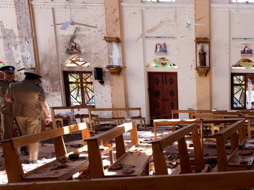 Police officers work at the scene at St. Sebastian Catholic Church, after bomb blasts ripped through churches and luxury hotels in Negombo, Sri Lanka on April 22. Police officers work at the scene at St. Sebastian Catholic Church, after bomb blasts ripped through churches and luxury hotels in Negombo, Sri Lanka on April 22.