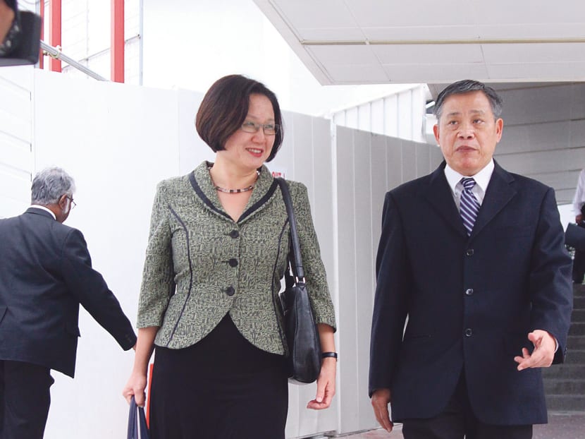 Ms Sylvia Lim (left, with lawyer Peter Low) disagreed with the prosecution’s claims that AHPETC had not taken ‘reasonable care’ to avoid violating the law. PHOTO: ERNEST CHUA