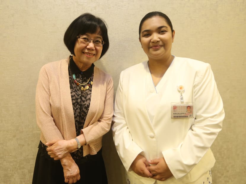 Norlaila Bte Kamarudin (right) an Assistant Nurse Clinician at the National Skin Centre, received the Nurses' Merit Award 2015 at the Nurses' Merit Award Presentation held at Orchard Hotel on 24 Jul 2015. With her is the Office of the Director of Medical Services' Chief Nursing Officer Tan Soh Chin. Photo: Ooi Boon Keong