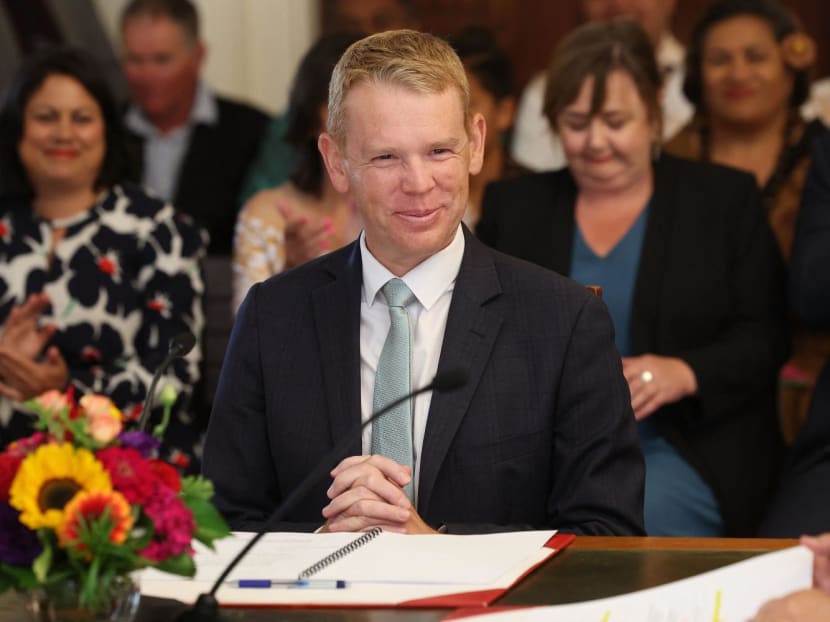 New Zealand's new Prime Minister Chris Hipkins smiles as he is sworn in by Governor General Dame Cindy Kiro during a ceremony at The Government House in Wellington on Jan 25, 2023.