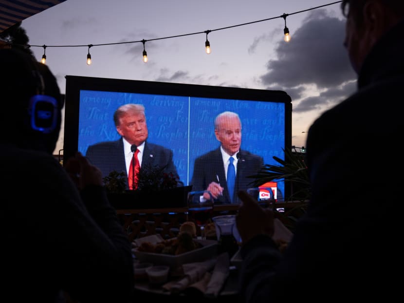 US president Donald Trump and Democratic presidential candidate Joe Biden’s presidential debate is broadcast and watched at a tavern in San Diego, California, US on Oct 22, 2020. Photo: Reuters