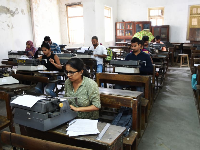 Candidates sitting for the last official typing exam conducted by the state government in Mumbai this week. Roughly 700,000 students across the state sit for their official manual typing certification every year. Photo: AFP