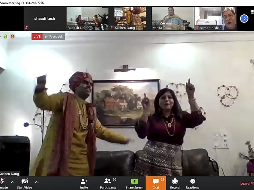 A screenshot of a video call on April 19, 2020, received courtesy of Shaadi.com, shows groom Sushen Dang (left) dancing with a family member at his home in Mumbai during his livestreamed wedding celebrations with bride Keerti Narang (not pictured).