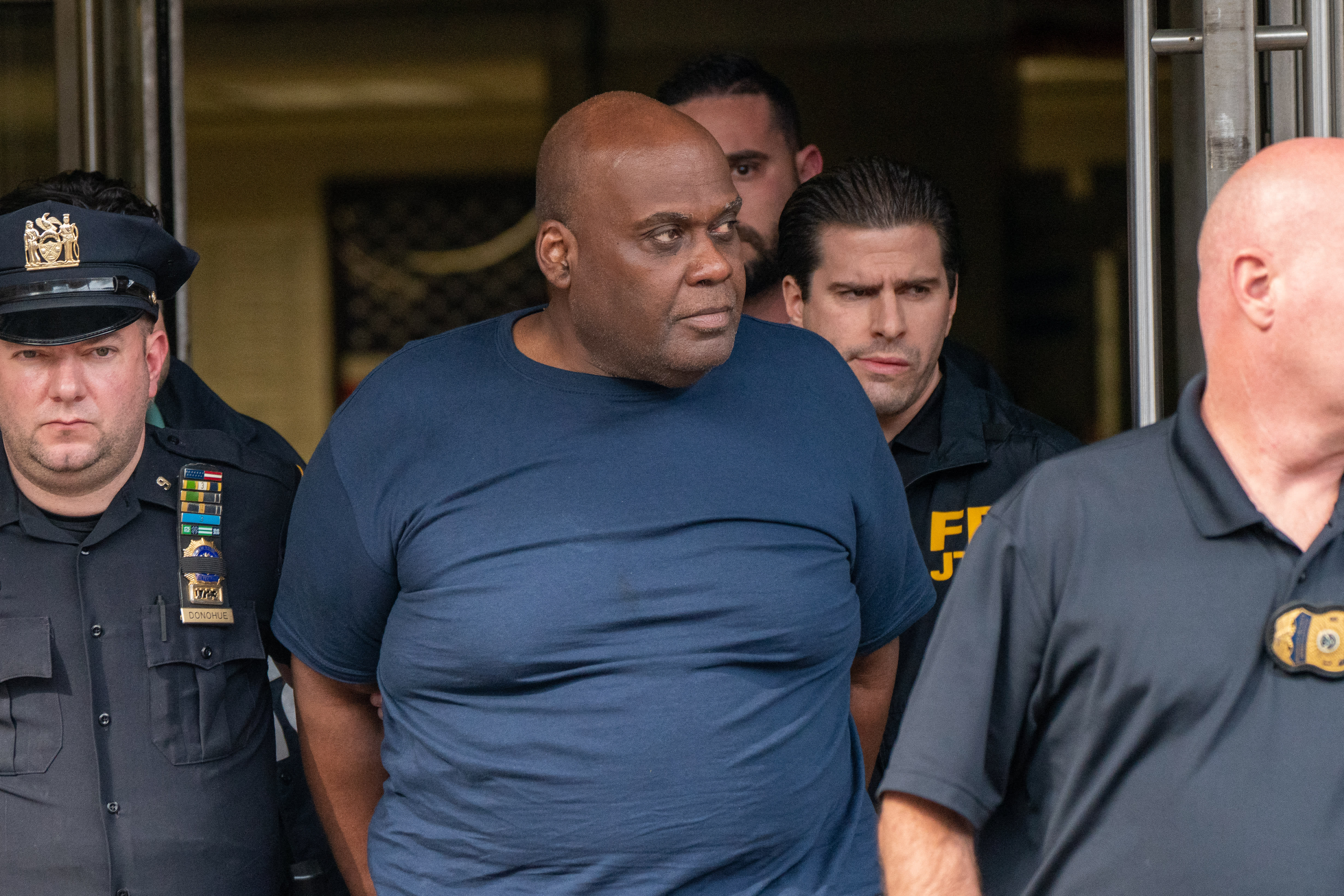 Suspect Frank James (centre) is escorted out of the 9th Precinct by police after being arrested for his connection to the mass shooting at the 36 St subway station on April 13, 2022 in New York City. Suspect Frank James (centre) is escorted out of the 9th Precinct by police after being arrested for his connection to the mass shooting at the 36 St subway station on April 13, 2022 in New York City.