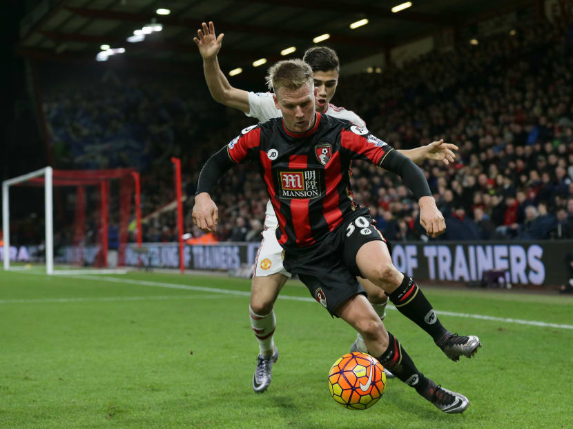 Bournemouth’s Matt Ritchie, foreground,  competes for the ball with Manchester United’s Andreas Pereira during the English Premier League soccer match between Bournemouth and Manchester United at the Vitality Stadium in Bournemouth, England, Saturday Dec. 12, 2015. Photo: AP