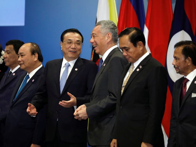 China's Premier Li Keqiang poses for a group photo with Asean leaders at the Asean-China Summit in Singapore on November 14.