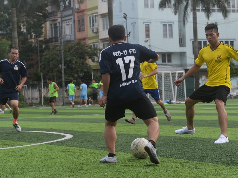 Members of the No-U FC squad playing in their weekly football match at a local pitch in Hanoi. The team of political dissidents has turned to football to circumvent government efforts to block their meetings. Photo: AFP