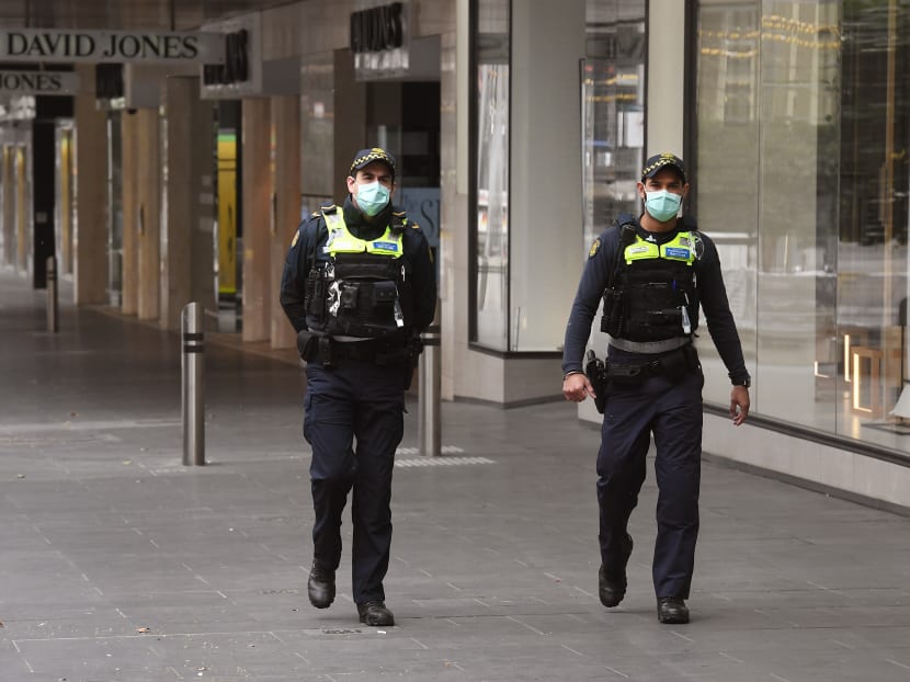Protective services officers patrol along an empty Bourke Steet Mall in Melbourne's central business district on Sept 2, 2020. Australia has entered its first recession since 1991 after the economy shrank seven per cent in the second quarter, official figures showed on Sept 2, as the country reels from the coronavirus pandemic.