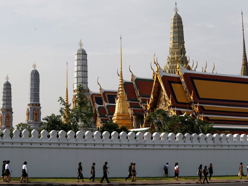 Mourners arrive to the Grand Palace to pay respect to Thailand's late King Bhumibol Adulyadej in Bangkok, Oct 14. PHOTO: Reuters
