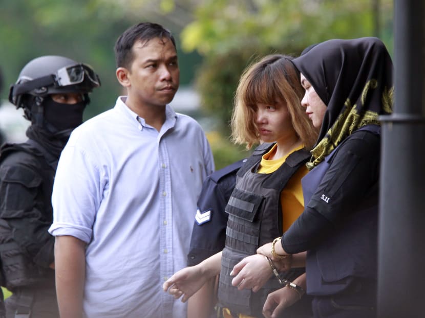 Suspect Doan Thi Huong from Vietnam, second from right, escort by police officers come out from Sepang court in Sepang, Malaysia on Wednesday, March 1, 2017. Photo: AP