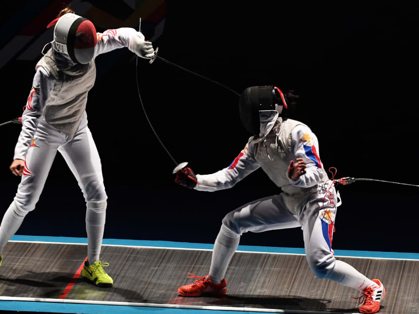 Amita Berthier (left) competes with Samantha Kyle Catantan of the Philippines  during the women's foil individual final of the 29th Southeast Asian Games (SEA Games) in Kuala Lumpur on August 21, 2017. Photo: AFP